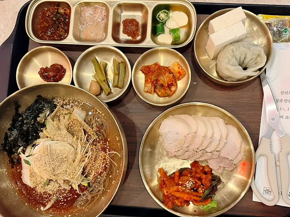 Bibim makguksu set with half bossam, mu-saengchae, tofu and mandu