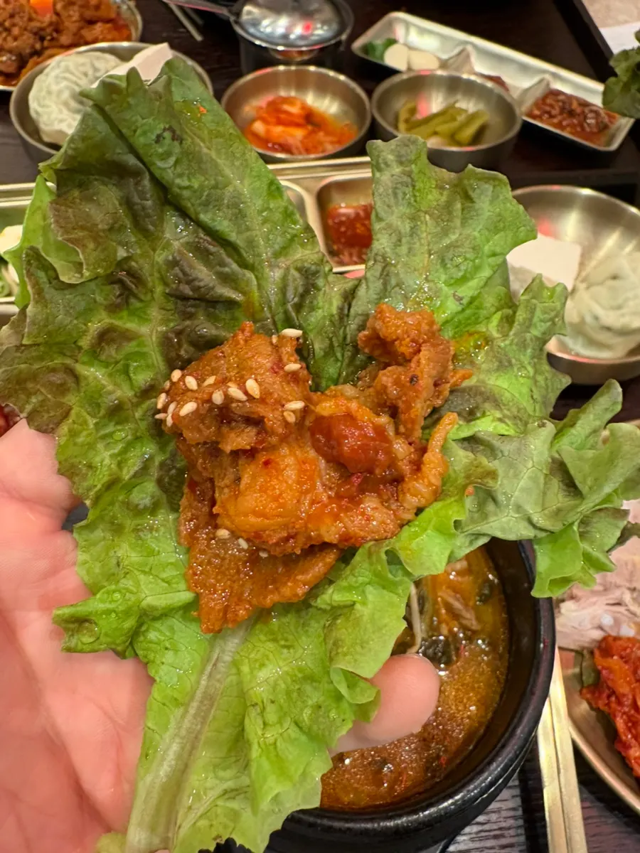 Jeyuk bokkeum piled onto lettuce