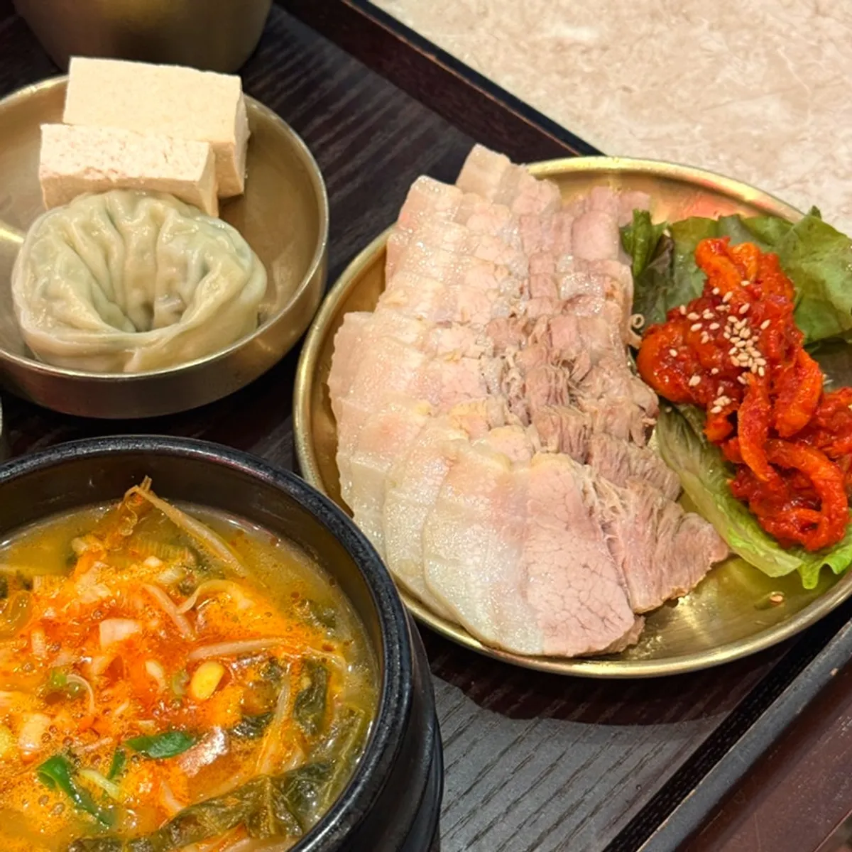Full spread of the bossam set and gondre bibimbap set