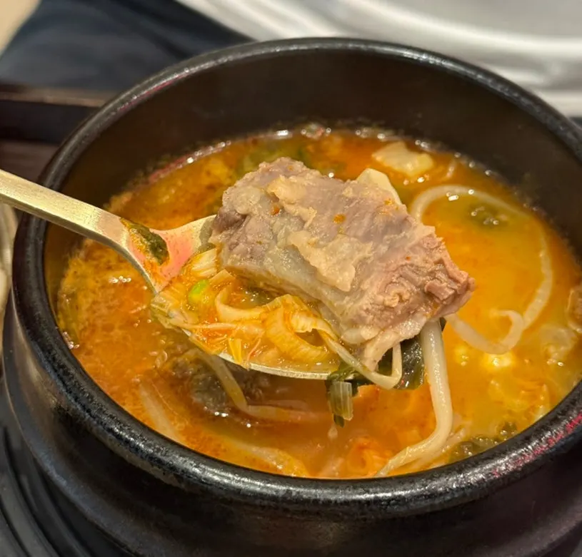 Spicy hangover soup served with the bossam set