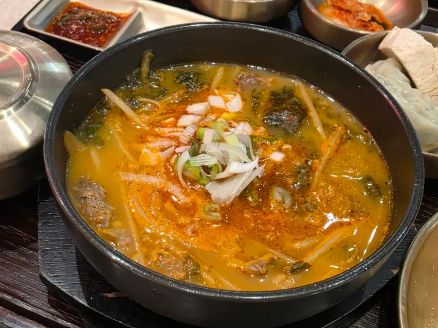 Full table setting of the Andong gukbap set with extra tofu