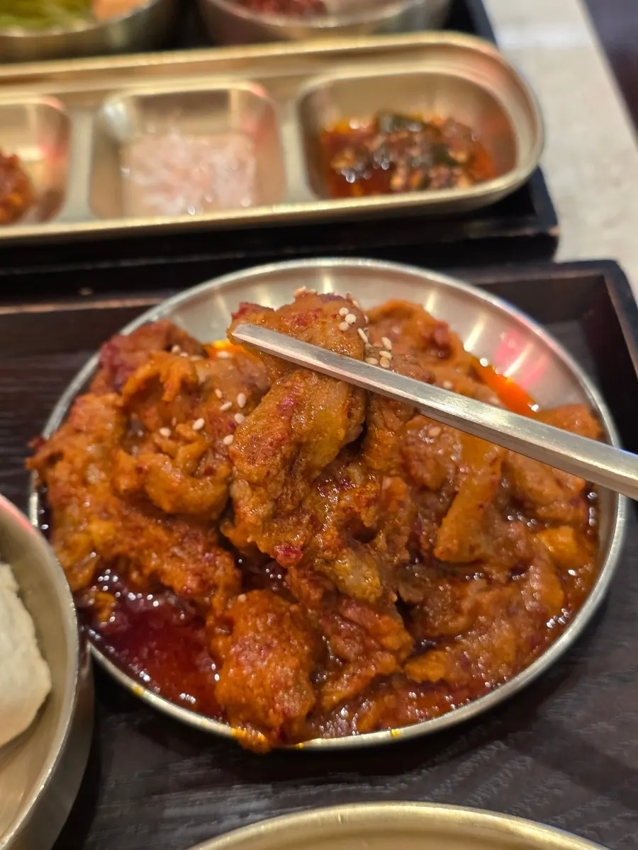 A plate of saucy jeyuk bokkeum (spicy stir-fried pork)