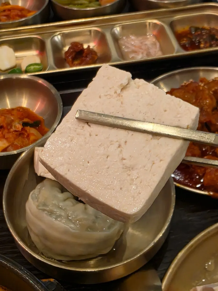 A plate of extra warm tofu ordered as a side