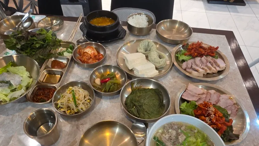 Bossam set spread with andong guksu and gukbap chosen for the meal