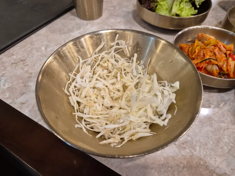 Boiled pork served with side dishes on the table