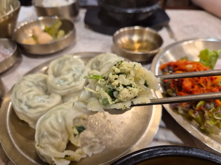 A dumpling cut in half showing the filling