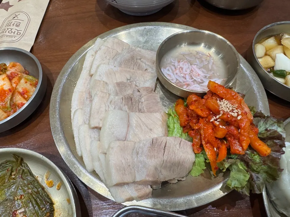 Bossam plate served with lettuce and pickled sides