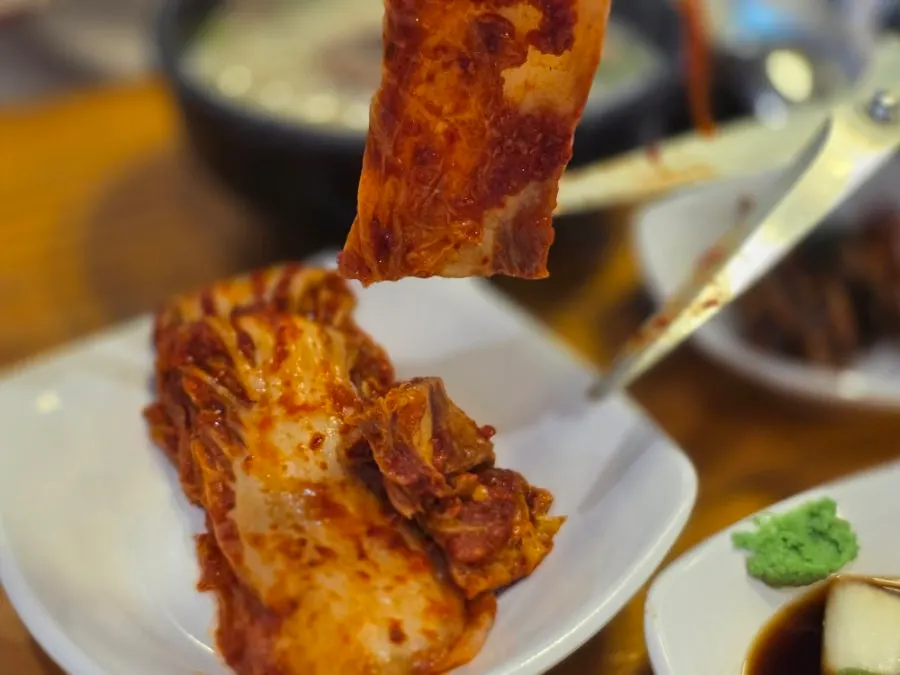 Kimchi and diced radish kimchi served alongside the gukbap