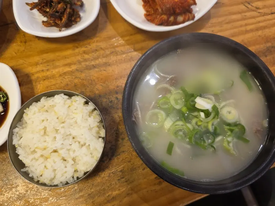 Two bowls of gukbap on the table at Hanwoojang