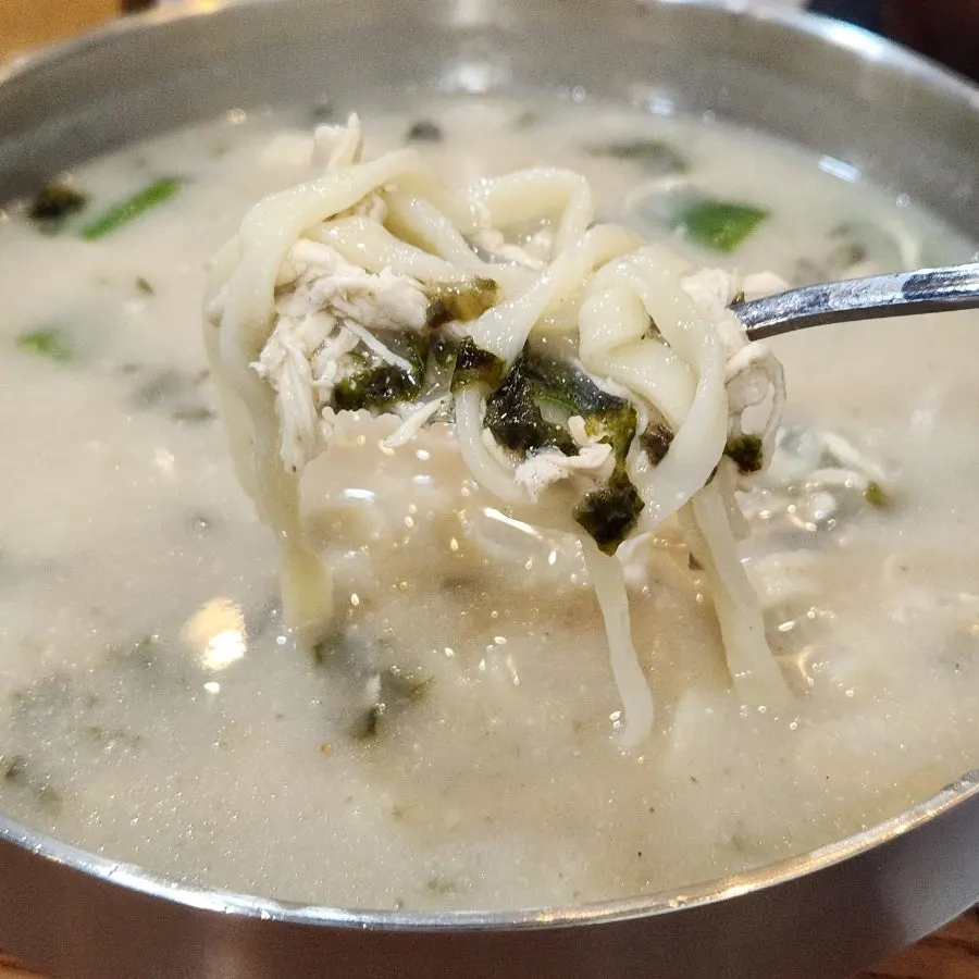 Chewy kalguksu noodles lifted from the bowl