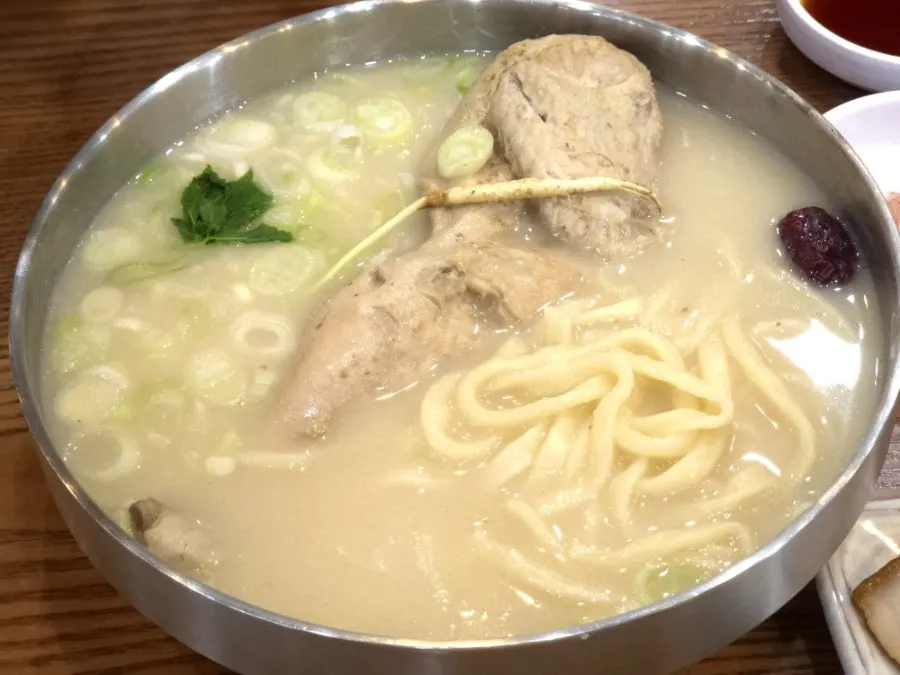 A spoonful of the rich chicken broth