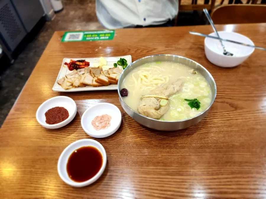 The dak kalguksu bowl near the end of the meal