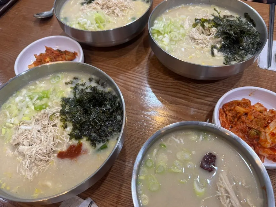 Table set with spicy and mild chicken kalguksu