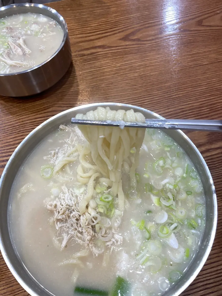 Sign explaining the house-made broth and noodles