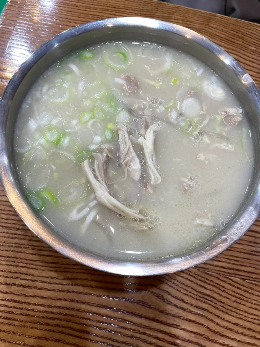 Sign explaining the 12-hour chicken broth and 48-hour aged homemade noodles