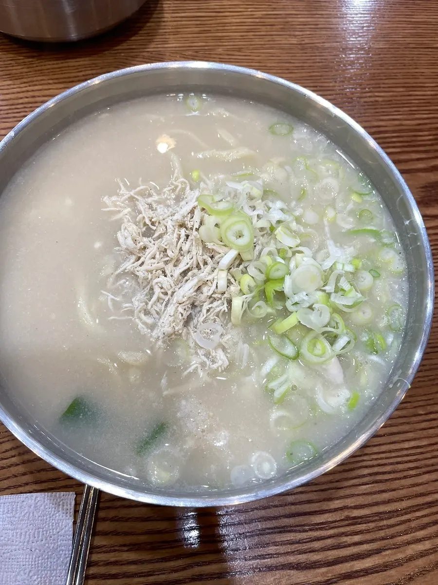 Basic chicken kalguksu topped with shredded chicken breast