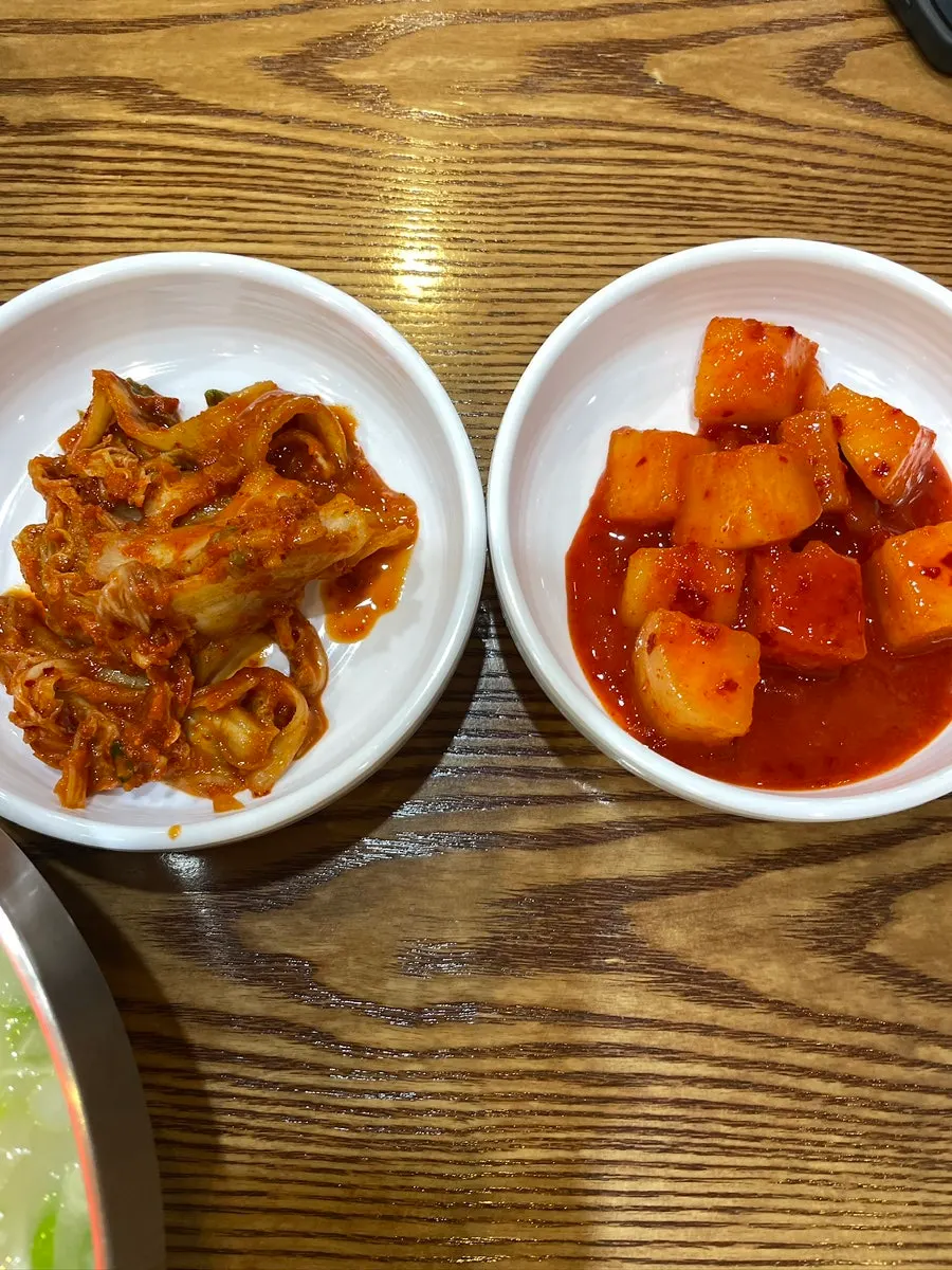 House-made spicy kimchi and kkakdugi self-bar