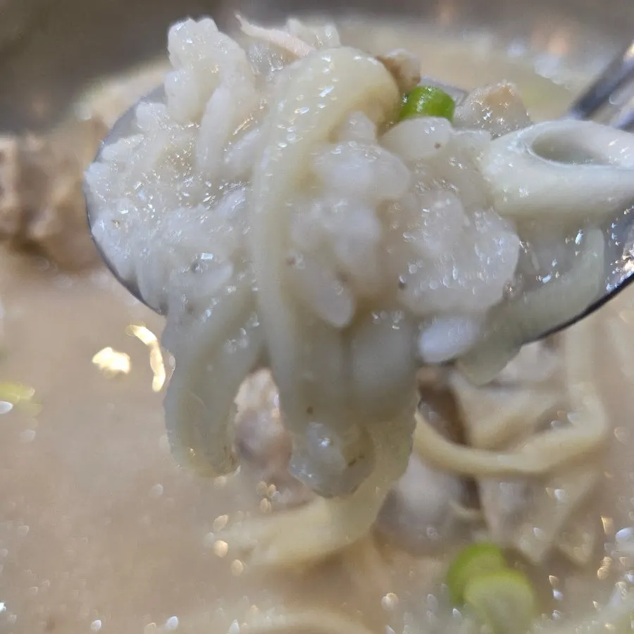Table setting with rice and noodles from the samgyetang kalguksu