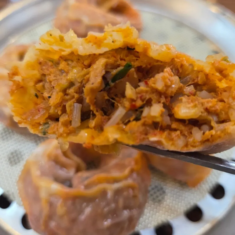 Cross-section of a mandu packed with kimchi filling