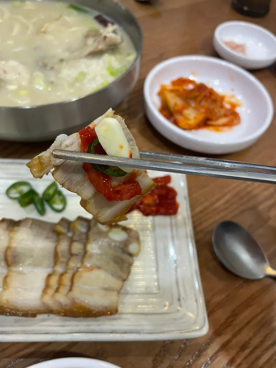 A piece of suyuk topped with dried radish and chili