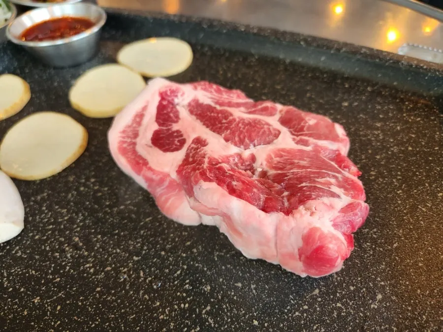 Aged pork neck meal enjoyed in Hapjeong