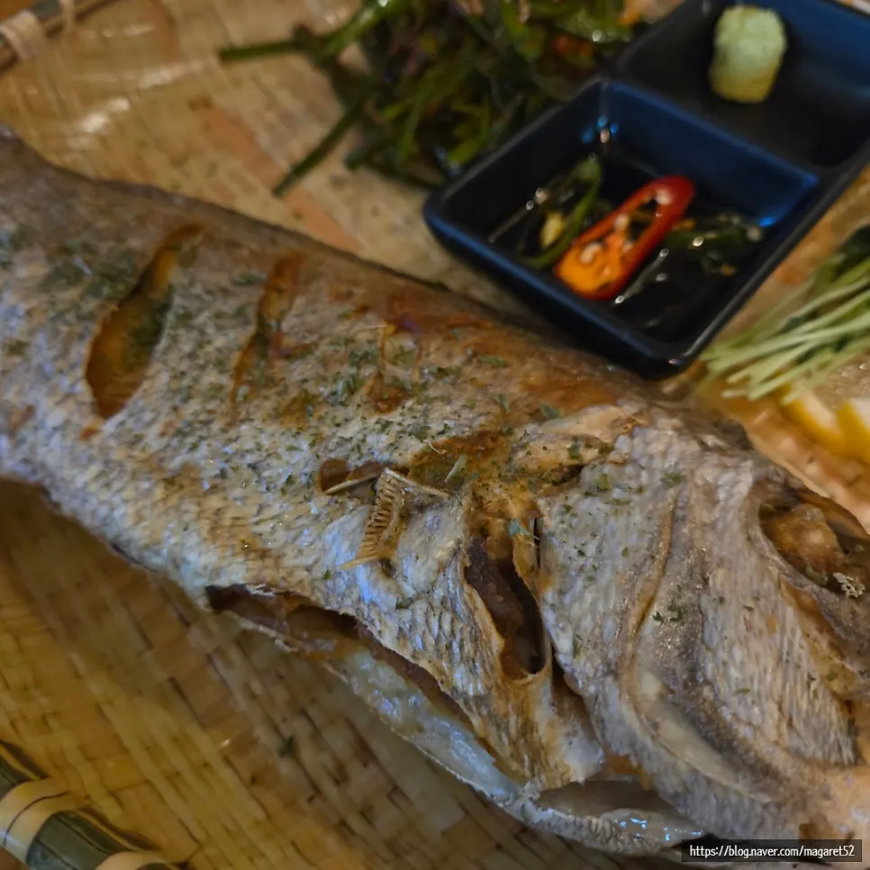 Grilled sea bream served in a bamboo basket