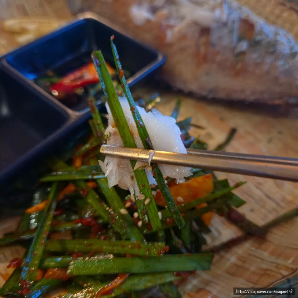 Grilled sea bream served with chive salad and cheongyang chili soy sauce