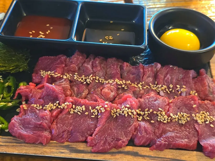 Korean beef yuk sashimi on a wooden plate