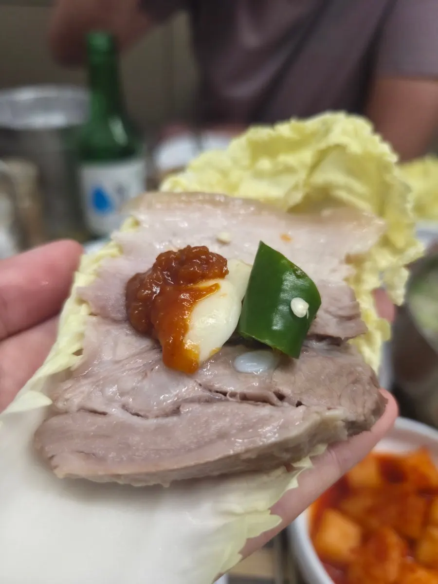 A slice of bossam with a good meat-to-fat ratio