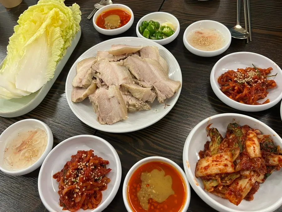 Generous basic table setting with napa cabbage and kimchi
