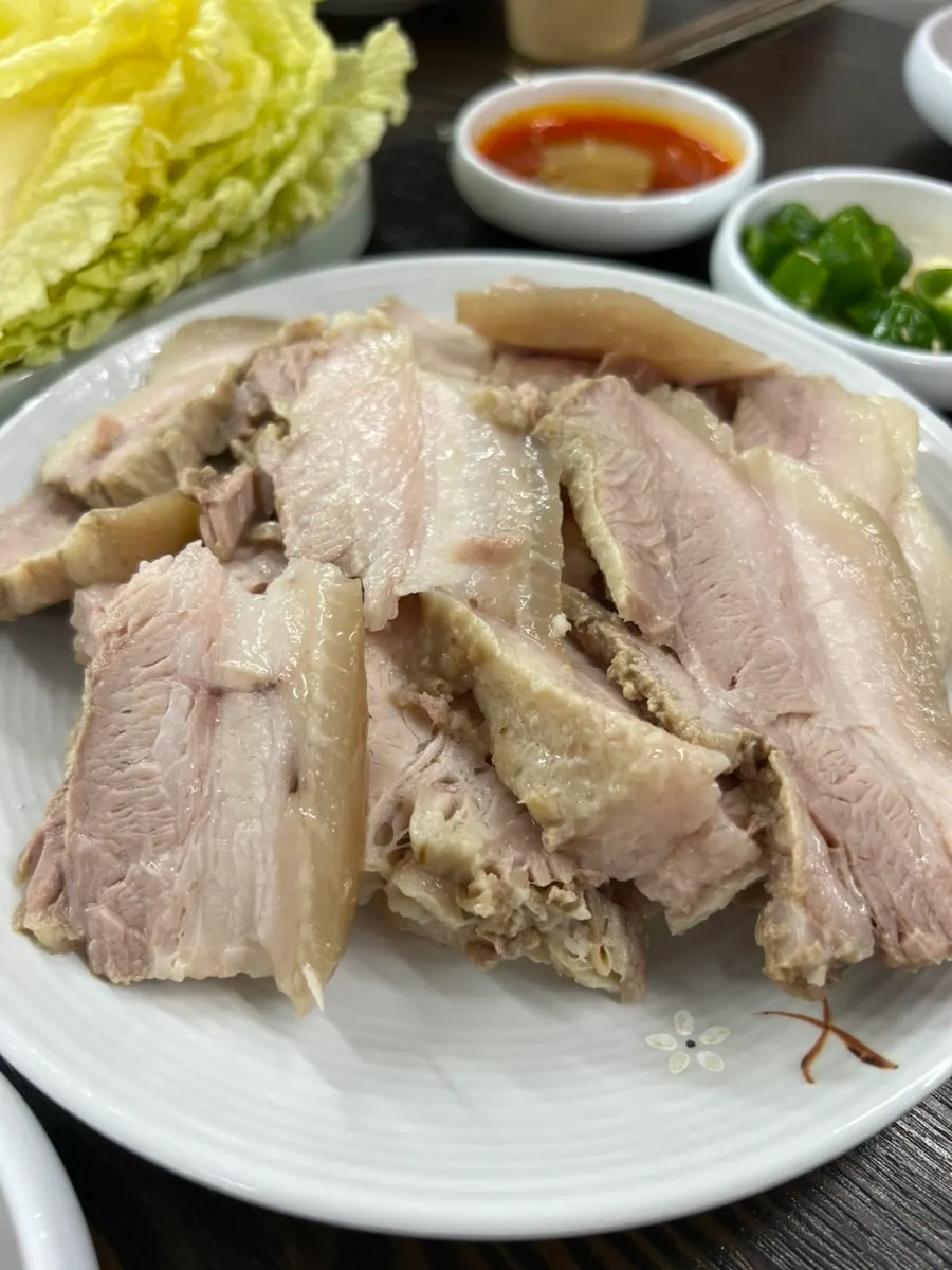 Thick-cut medium bossam on a white plate