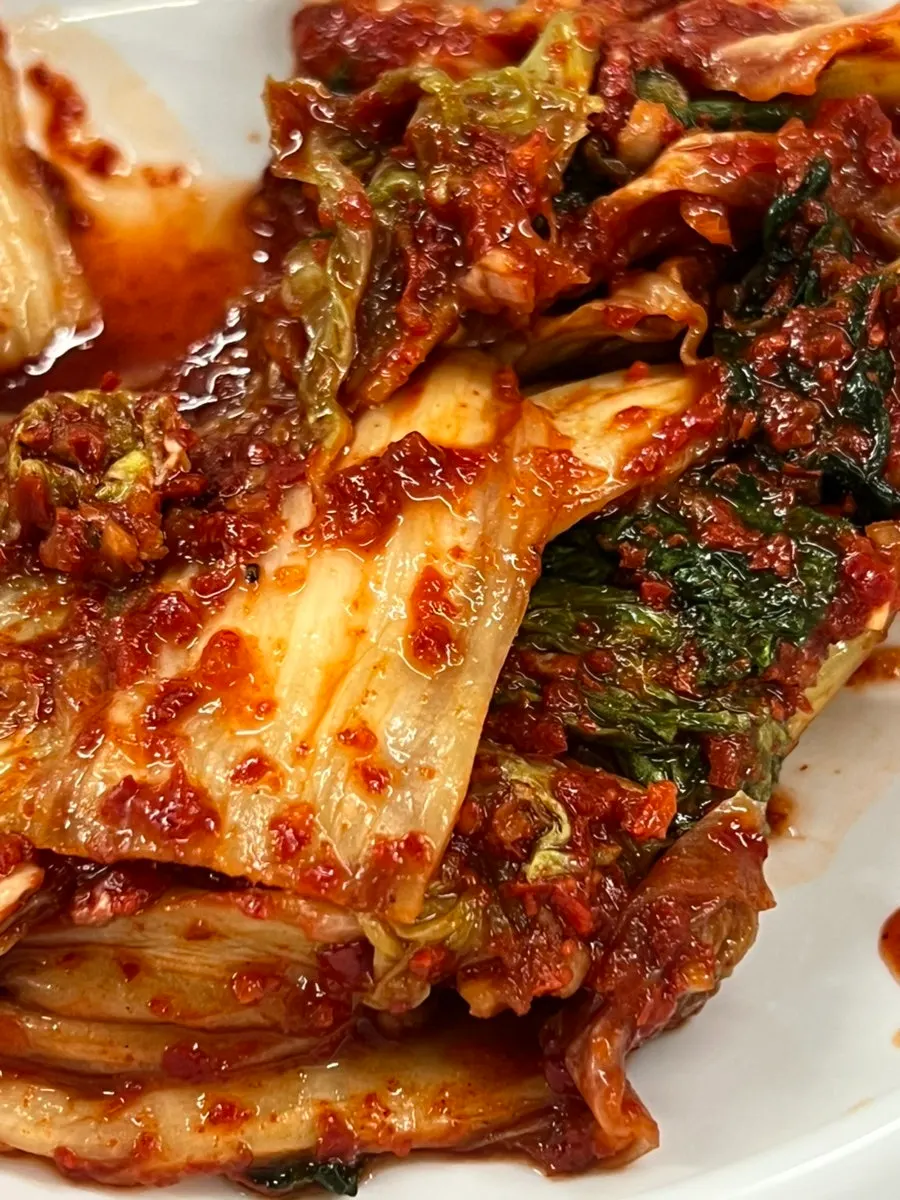 Seasoned cabbage kimchi served alongside bossam