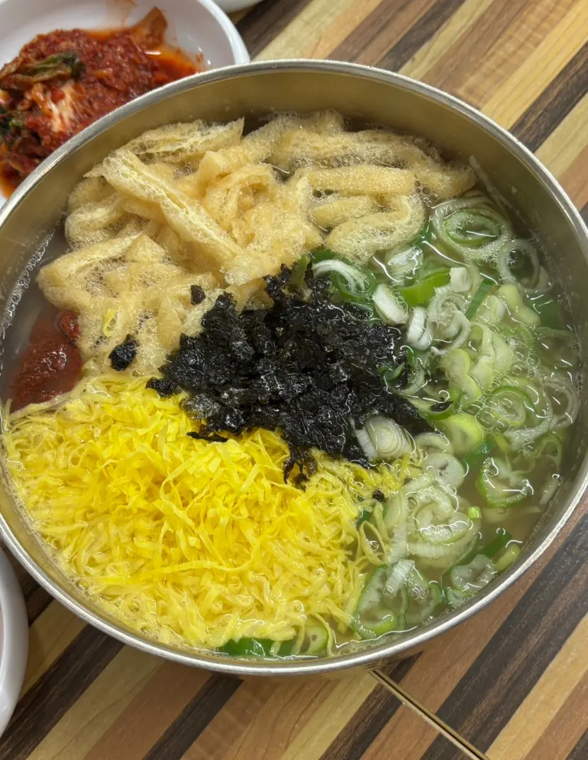 Anchovy kalguksu served in a large bowl