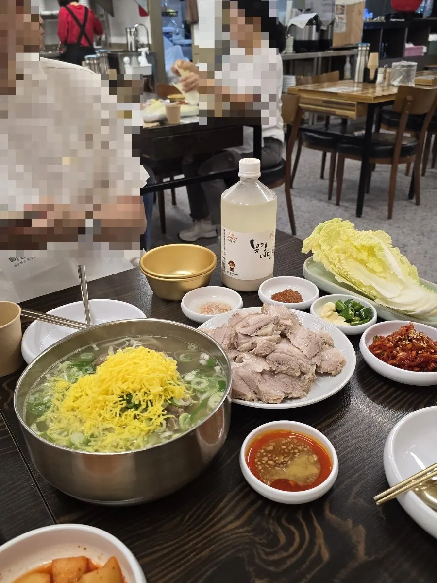 Ordered bossam suyuk and bone kalguksu table setting