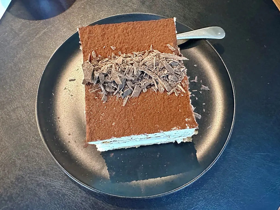 Tiramisu topped with cocoa powder and chocolate