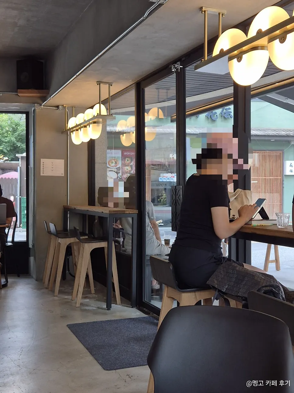 Café interior full of customers on a weekday afternoon
