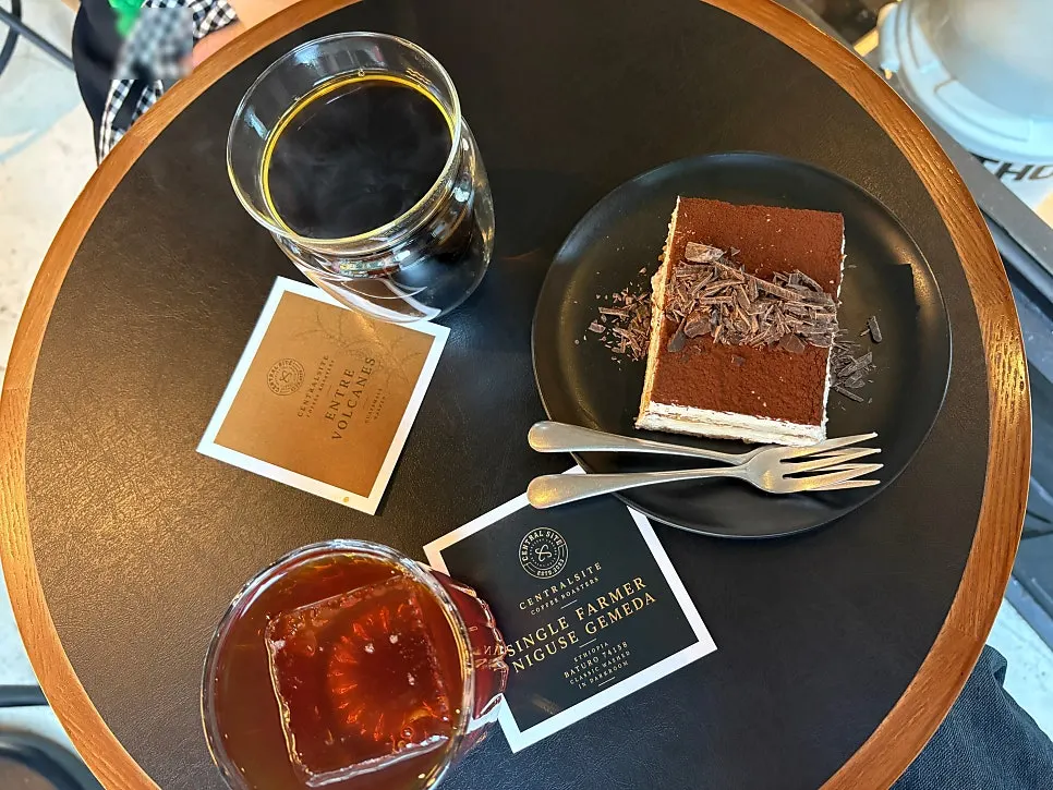 Two specialty drip coffees being served