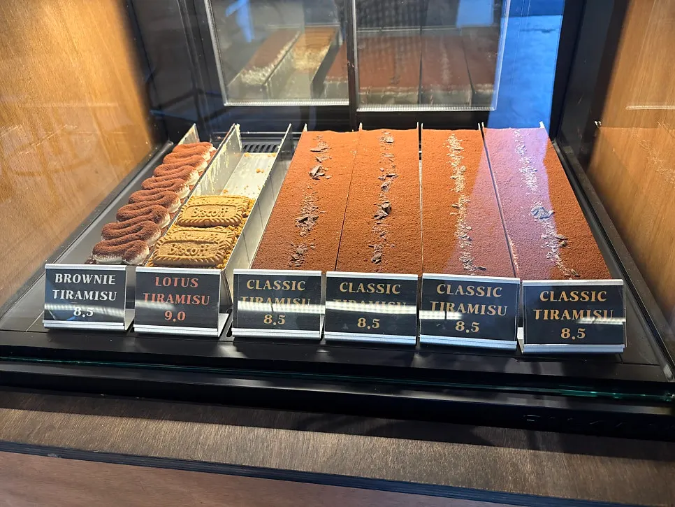 Dessert case showing different tiramisu flavors