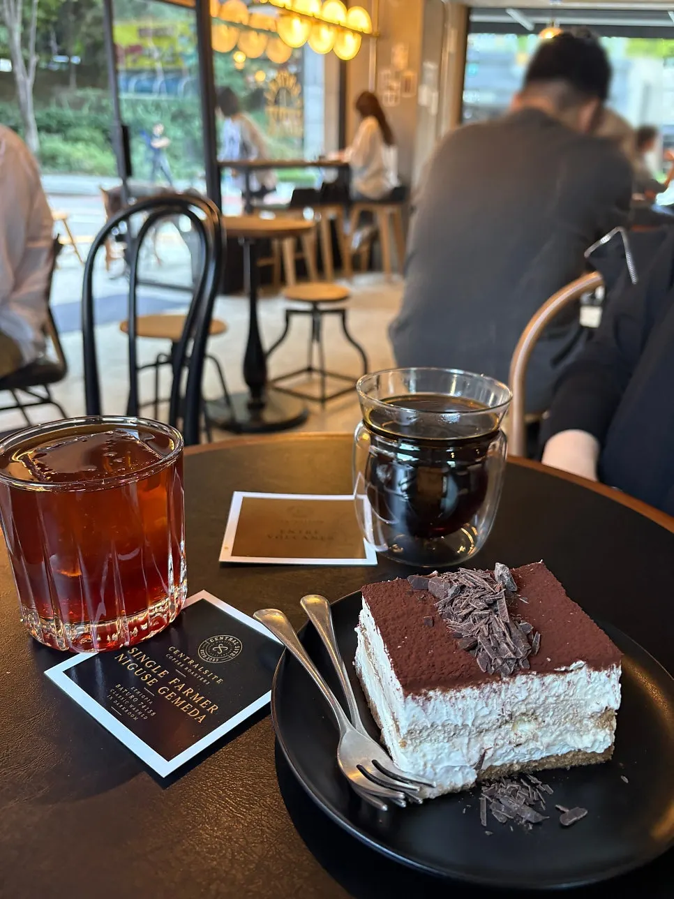 Classic tiramisu topped with cocoa powder and chocolate