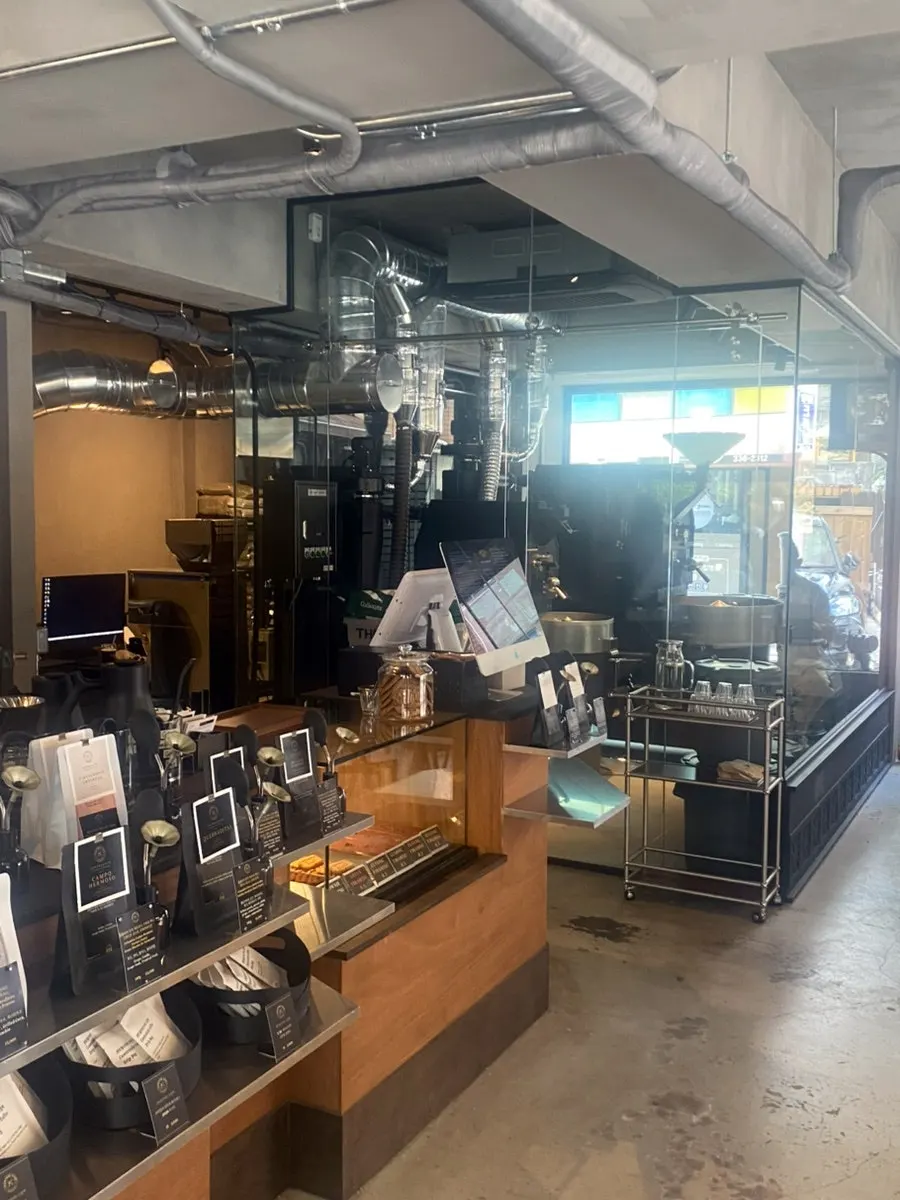Interior of Central Site Hapjeong lit by sunlight through the floor-to-ceiling windows