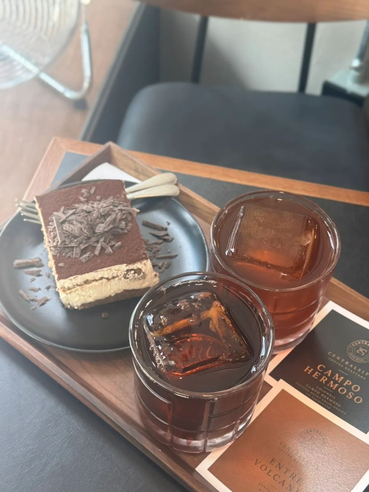 Tiramisu served together with drip coffee on the table
