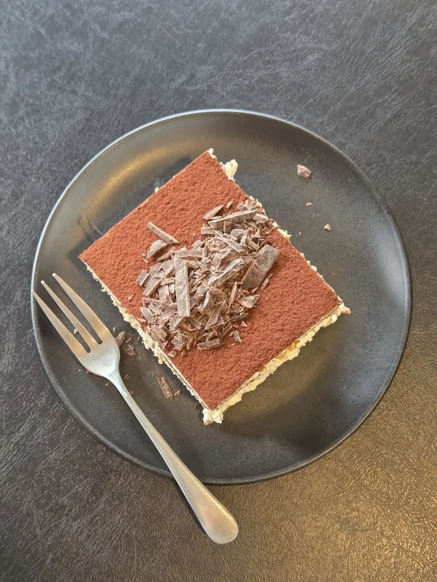 A perfectly square slice of classic tiramisu