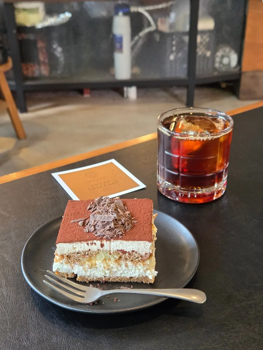 Drip coffee and tiramisu placed together on the table