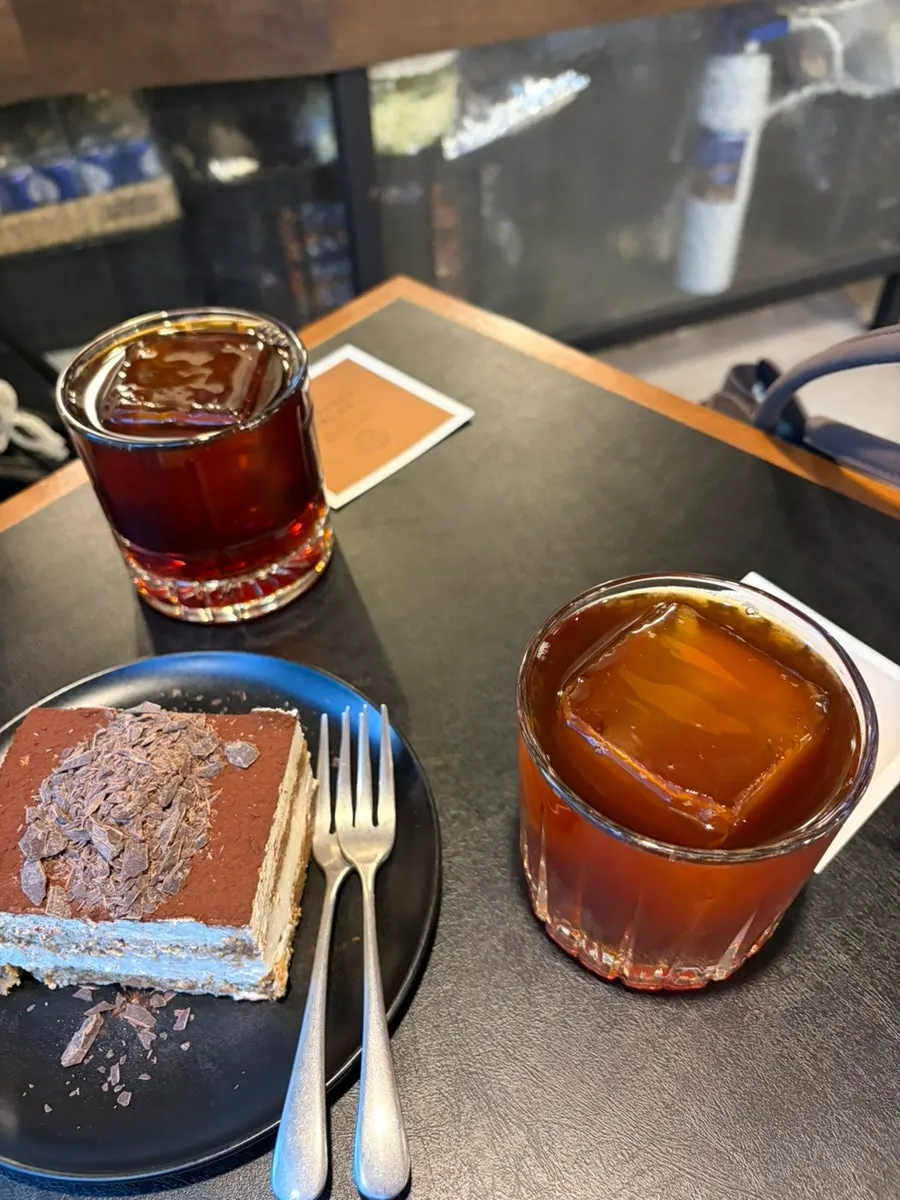 Brewing drip coffee and tiramisu on the table