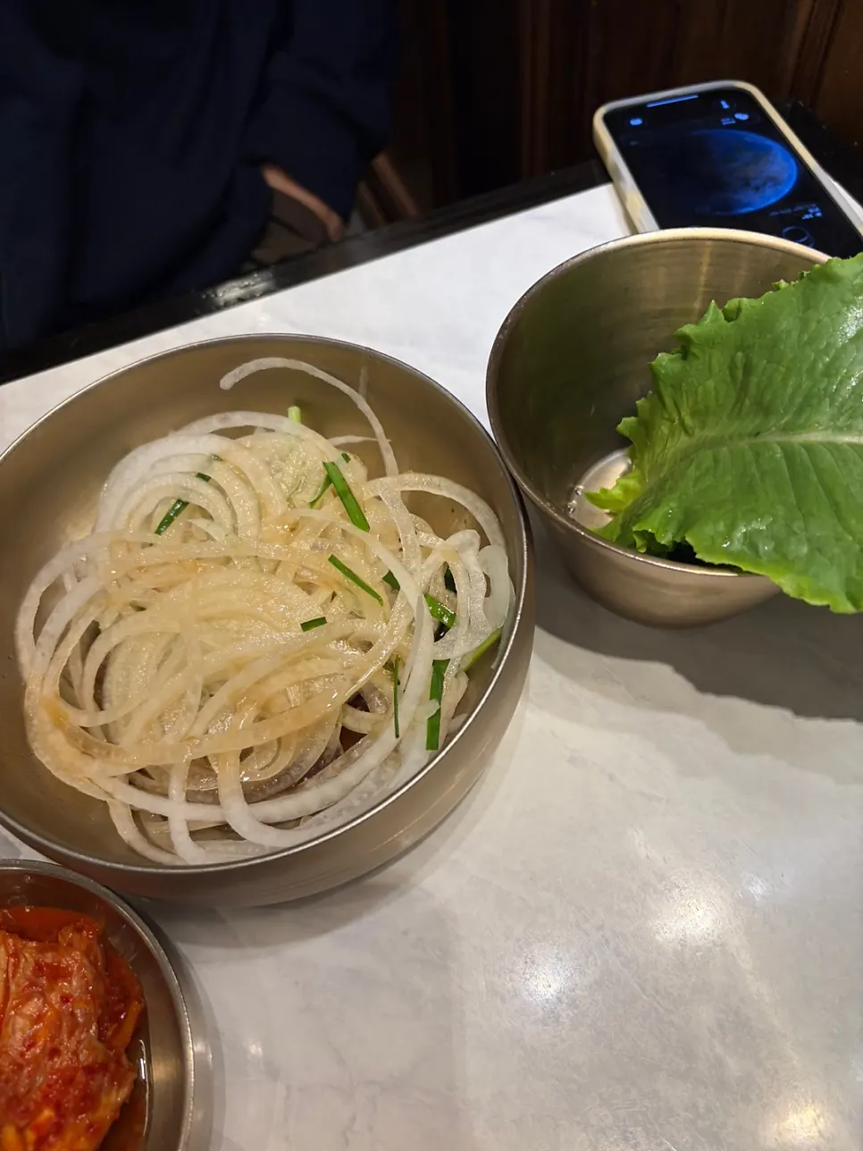 Korean side dishes and sauces served with meat