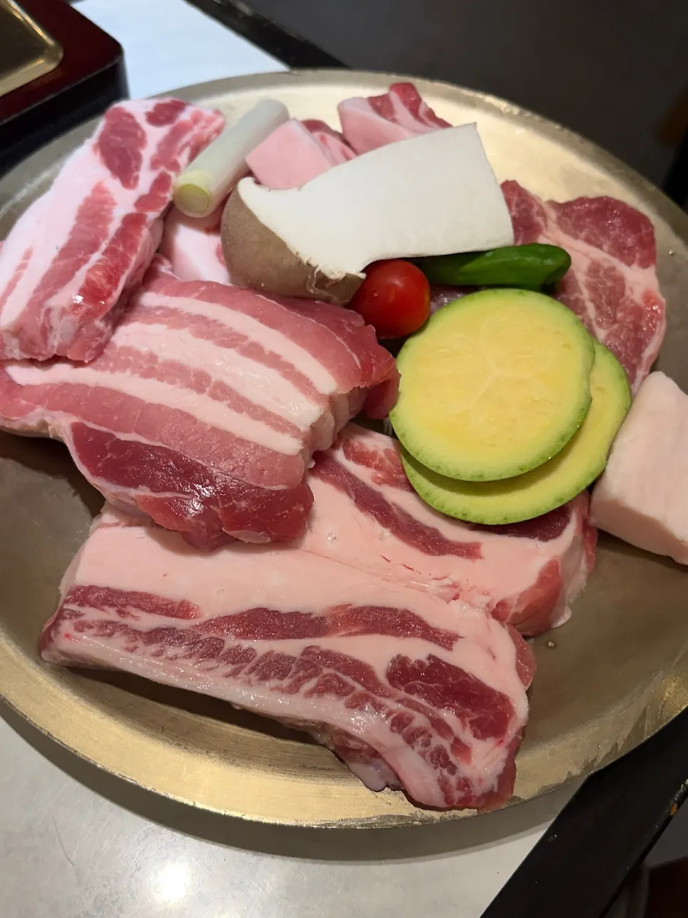 Bone pork belly before grilling over charcoal