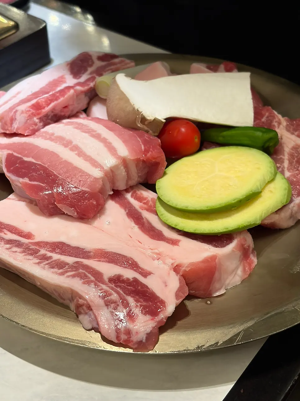 Bone pork belly, pork neck, and accompanying vegetables