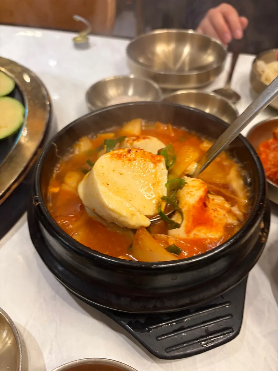 Spicy soft tofu stew served with meat