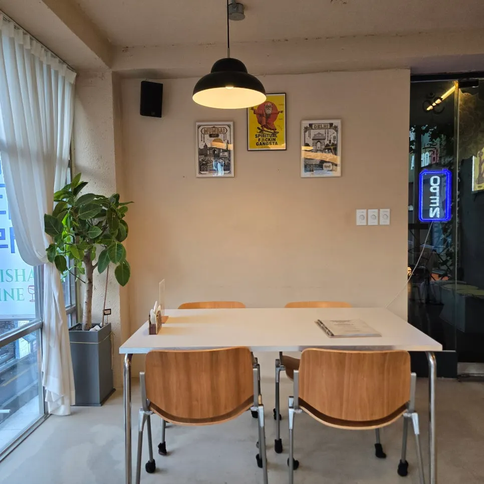 Dining area with floor-to-ceiling windows and tables