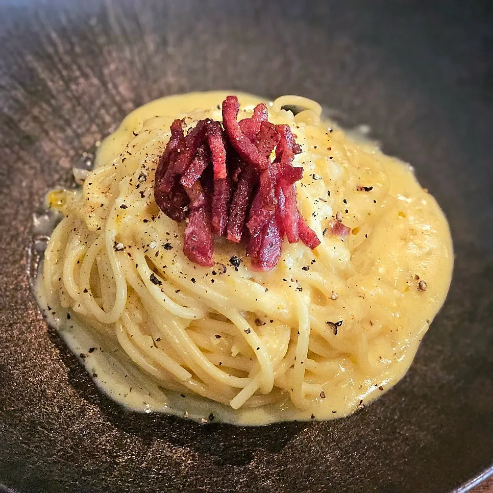 Creamy egg pasta topped with bacon